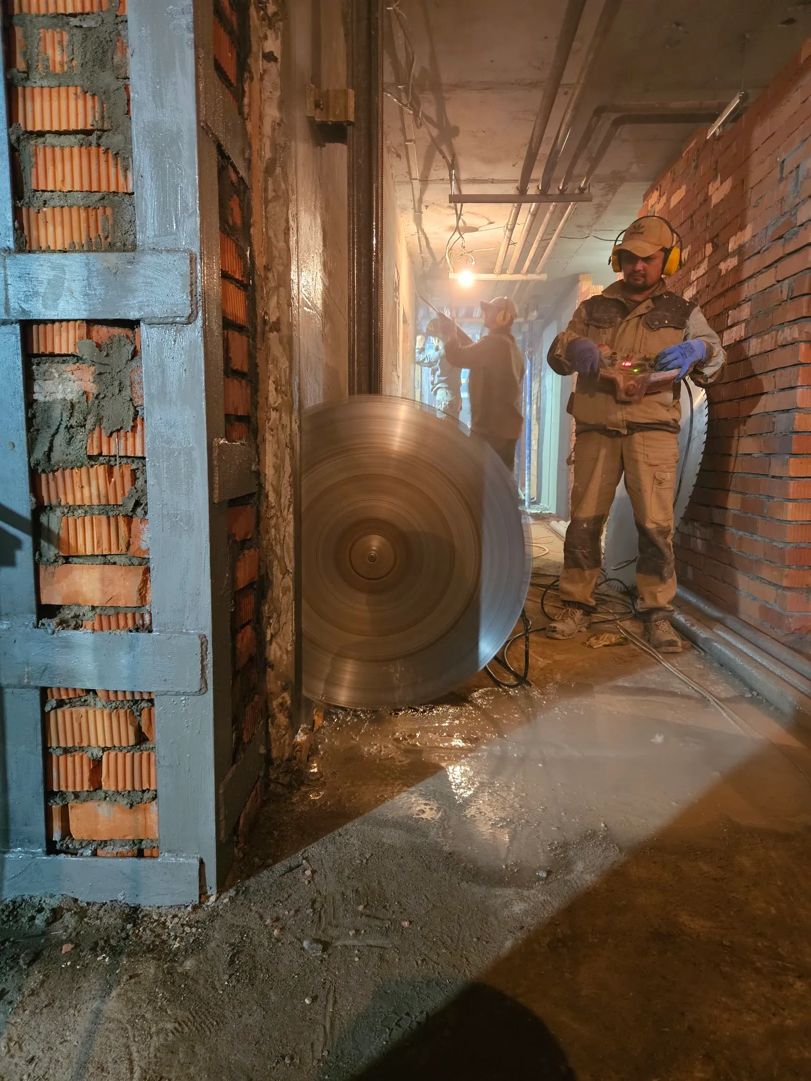 Pile of extracted concrete cores and cut blocks during selective demolition