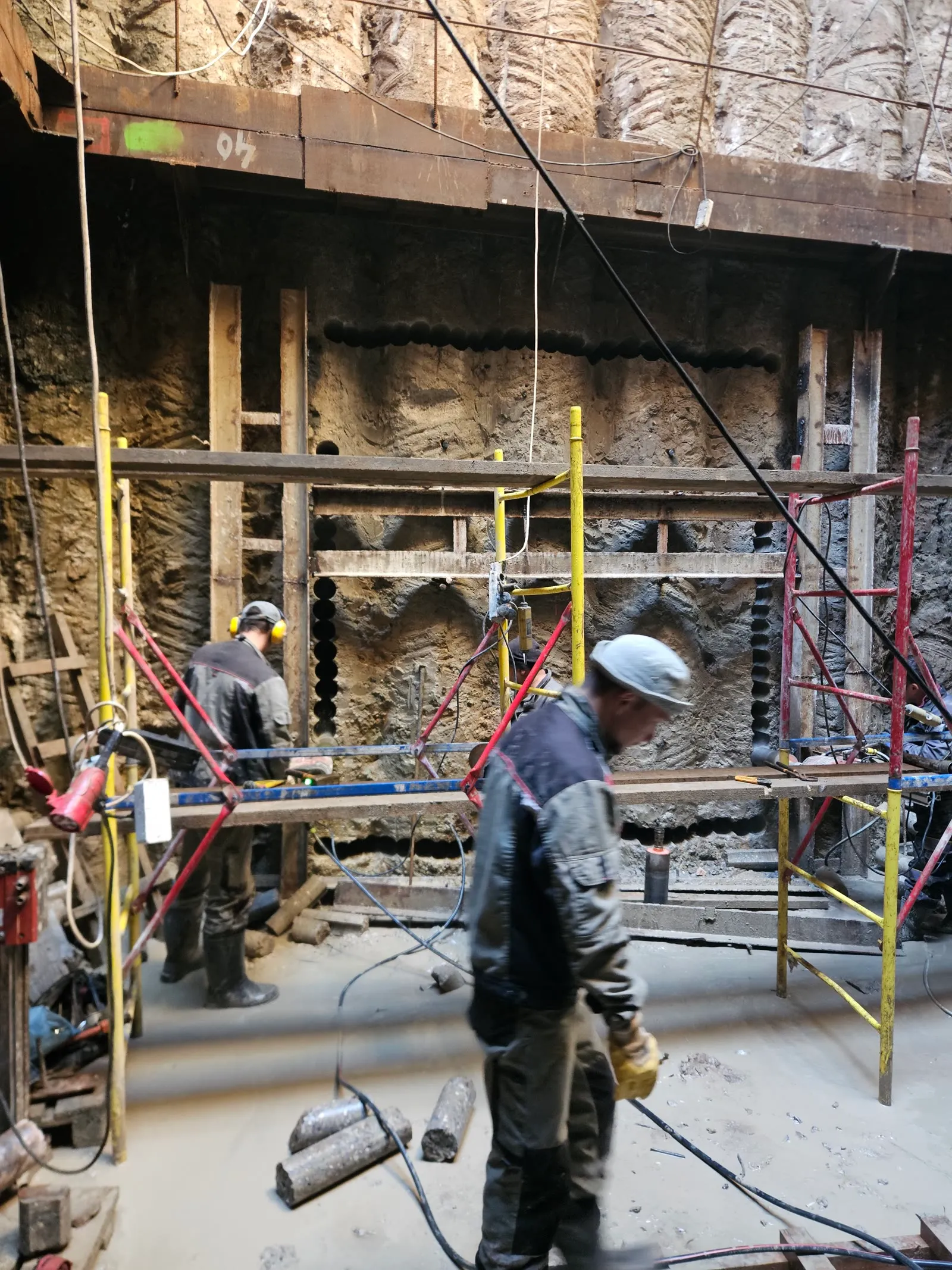 Rectangular opening perimeter formed by overlapping line-drilled cores in a foundation wall