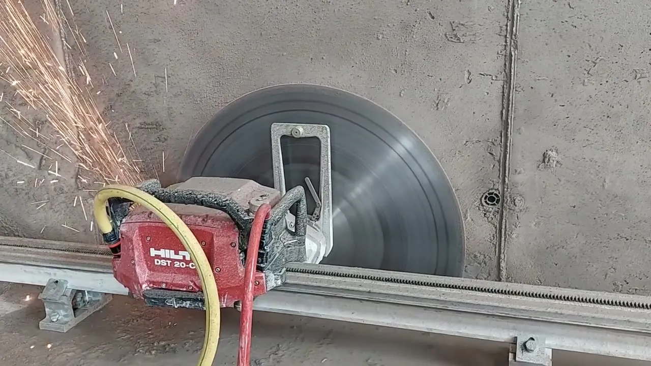 Wall saw cutting reinforced concrete — video still